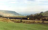 A Class 25 (unidentified) on the last stages of the climb out of the Eden Valley to Ais Gill summit with a Carlisle to Leeds passenger working in 1981.<br><br>[Mark Bartlett //1981]