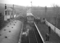 A dreich day at  Tillynaught Junction, just after 8pm on Saturday 4 May 1968, with the driver of the final coast train from Aberdeen to Elgin exchanging tokens with the Tillynaught signalman. Meantime, the last eastbound train (hauled by Birmingham Type 2 D5331) waits in the passing loop.<br>
<br><br>[David Spaven 04/05/1968]