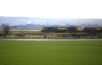 Looking south across the Forth as Freightliner 66605 approaches Longannet Power Station with a coal train on 16 November.<br><br>[Bill Roberton 16/11/2009]