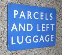 Parcels and Left Luggage sign in Scottish Region blue.<br><br>[David Panton //]