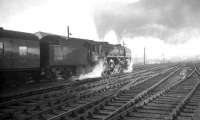 A southbound train leaves Carlisle on a Summer evening in the mid sixties behind a Britannia Pacific.<br><br>[Robin Barbour Collection (Courtesy Bruce McCartney) //]