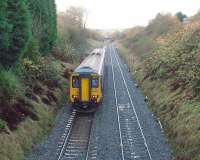 The change in gradient can be seen ahead of 156479 as it leaves Ramsgreave and Wilpshire for Blackburn and begins the descent to Daisyfield Junction. It was this steep gradient that necessitated the sand drag being installed at Daisyfield [See image 26413] to protect the East Lancashire line junction when loose coupled diesel hauled freights were routed this way after the WCML was electrified. <br><br>[Mark Bartlett 17/11/2009]