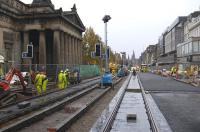 ...Edinburgh tram works, looking west along Princes Street at the foot of The Mound on 24 November 2009, with two continuous tracks now in place between Waverley Bridge and Lothian Road. The road surface is currently being restored before handing Princes Street over to Christmas shoppers etc from 29 November!<br>
<br><br>[Bill Roberton 24/11/2009]
