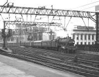 Scene at Glasgow Central on Fair Friday, 15 July 1966, as Holbeck Jubilee no 45593 <I>Kolhapur</I> leaves with a special.<br><br>[Colin Miller 15/07/1966]