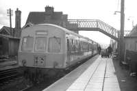 A Shrewsbury bound DMU involved in mail bag transfer at Machynlleth in the early 1970s. View is west towards Dovey Junction.<br><br>[David Spaven //]