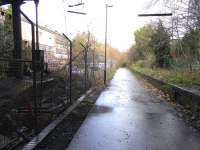 Looking towards Leith from under the road bridge at Newhaven station <br>
(closed 1962) on 25 November. Quadruple tracks ran through here: only enough of the Down passenger platform has been left to base the supports for the bridge and street-level station building; to the left of it the goods lines once ran to George Street, Leith. George Street itself was renamed when the duplicated Edinburgh/Leith street names were sorted out in 1966, by which time this wouldn't have mattered much to the doomed depot. <br>
<br><br>[David Panton 25/11/2009]