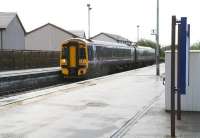 The 1038 Inverness - Wick arrives at Muir of Ord on 3 October 2009. Most of the former railway land here has been disposed of in recent years with a housing development occupying the area beyond the fence that now forms the eastern boundary of the station.<br>
<br><br>[John Furnevel 03/10/2009]