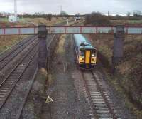 <I>Me next</I>. As 153378 leaves the Ormskirk line at Farington Curve Junction, a Class 158 Sprinter on a service from York waits on the curve for its turn to join the main line to run into Preston. <br><br>[Mark Bartlett 27/11/2009]