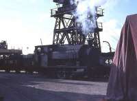 <I>Progress</I>, one of seven Bagnall 0-6-0ST locos in use on the Preston dock system, is seen among some internal user wagons on the dockside in 1968, towards the end of steam working. Sister engine <I>Princess</I> survives at Haverthwaite [See image 26556] and the name <I>Progress</I> was carried on one of the three Sentinel diesels that arrived in 1968 to replace the Bagnalls and is still used today on the Ribble Steam Railway.<br><br>[David Hindle //1968]