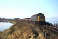 A Class 40-hauled Inverness-bound freight accelerates ways from Clachnaharry swing bridge in early 1981.<br><br>[Frank Spaven Collection (Courtesy David Spaven) //1981]