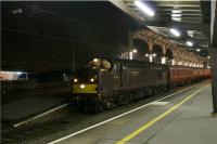 The St Nicholas Steam Express drops off passengers at Preston on the return trip from York on 28 November 2009. The special had started at Rose Grove in the morning travelled via Blackburn and Preston was diesel hauled as far as Carnforth where steam was scheduled to haul the train to York and back. WCRC diesels provided the traction between Rose Grove and Carnforth and 37516 was leading on the return trip.<br><br>[John McIntyre 28/11/2009]