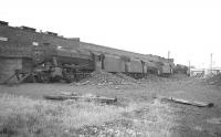 Locomotive lineup at Rose Grove shed in July 1968. The 8F at the buffer stops is 48451, next is Black 5 45397, beyond that 44690 and furthest away is 44899. The shed has long been demolished with much of the area now occupied by the M65 motorway.<br><br>[K A Gray /07/1968]