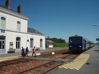Saujon is now the only surviving intermediate station on the single line branch between Saintes and the seaside terminus at Royan. The station has a passing loop and is still staffed and the station master can be seen here crossing to meet the recently arrived Angouleme to Royan train. Services on the line are a mixture of new diesel units and these first generation DMUs. This one comprises two single unit power cars with a trailer car in between.  <br><br>[Mark Bartlett 23/06/2009]