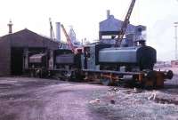 Just before closure of Millom Ironworks, Millom No.1 (AB 2333/1953) draws No.12 and No.3 out of the shed to be photographed. No.1 and No.12 (AB 929/1902) went to the Lakeside Railway soon afterwards. The development of the Barclay 0-4-0ST over many years can be seen by studying these two locos. No.3 had been built by New Lowca Engineering 250/1912 and was out of use with coupling rods removed. This loco came from Cleator Moor in 1932 but was little used as it was known to wear axleboxes unevenly, possibly due to a bent frame. Being a rare beast, efforts were made to find a buyer but in 1968 many locos in scrap yards were in full working order. There were no takers for this damaged machine and it was scrapped in 1969.<br><br>[David Hindle 19/09/1968]