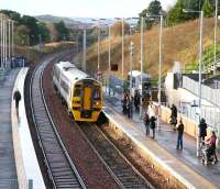 The 1054 ex-Bathgate, formed by Alphaline liveried 158871, runs into the eastbound platform at Livingston North on 27 November with an Edinburgh service. Work on the station appears essentially complete with improvements also noticeable in related areas such as general access and car parking. Electrification masts are now in place here but no wiring as yet.<br><br>[John Furnevel 27/11/2009]