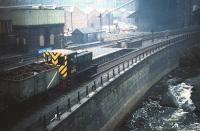 NBL D2737 with a train of scrap at Kelvin Hall on an overcast 19 September 1959. View east from Benalder Street bridge on which the station booking office was located. The diesel was one of a dozen locomotives allocated to 65G Yoker (Rothesay Dock) at that time (closed in January 1964). As for Kelvin Hall station, this was better known as Partick Central, a name it carried from its opening by the L&D in 1896 until mid 1959, with Kelvin Hall being applied from that point until closure in 1964. (Note: Railscot references use Partick Central.) The old station was finally demolished in January 2007 [see image 13369]. <br>
<br><br>[A Snapper (Courtesy Bruce McCartney) 19/09/1959]