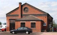 Looking rather healthier than its counterpart at Banbury [see image 26628], this goods shed clearly still earns its keep. I was tempted to Photoshop out the car, but above all, it's a Rover.<br><br>[Ken Strachan //2001]