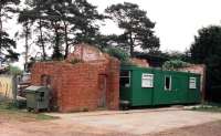 When I first found this goods shed, it looked fit for restoration and/or conversion. Sadly, by my second visit, it was rather beyond hope, acting solely as a windbreak for a Portakabin!<br><br>[Ken Strachan //2001]