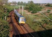 This picture is only 8 years old, but already historic, as Turbostars now rarely travel this way; but rather over reinstated track over the bridge just visible in the right background. [see image 34978] The 170 is heading for Birmingham, but the destination blind said: 'Norwich. Sorry?' The North Chord was barely a twinkle in NR's eye at this point!<br><br>[Ken Strachan //2001]