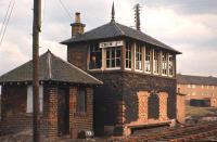 The now redundant Crew Junction box awaits its fate in July 1966. Fortunately the nameboard was (legitimately!) salvaged. Despite being located by Crewe Toll, the box name was deliberately spelt without an 'e' to avoid confusion with its bigger brother in Cheshire.<br><br>[Frank Spaven Collection (Courtesy David Spaven) /07/1966]