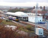 A Northern Pacer calls at Blackburn's rebuilt station on its way to Colne. To the right, partly obscured by the telephone mast, the original station entrance building is still in use but the huge trainshed that once spanned the platforms [See image 7725] is now demolished.<br><br>[Mark Bartlett 04/12/2009]