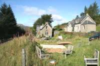 The former station house and railway cottages at Dalnaspidal, looking north towards Dalwhinnie on 26 September 2009. The remains of the station's up platform can be seen on the far left of the picture. Much changed since my last vist [see image 6094].<br>
<br>
<br><br>[John Furnevel 26/09/2009]