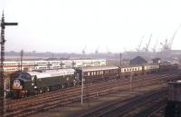 With D5308 in the rear, D368 eases the empty stock of the Royal Train into a temporary platform constructed near Leith North terminus on 16th October 1962, ready to convey King Olav of Norway on his state visit journey to Princes Street, where he was met by the Queen and Duke of Edinburgh. The fleet of Edinburgh Corporation Transport double-decker buses in the background had brought schoolchildren to the docks to act as a welcoming party for the King.<br><br>[Frank Spaven Collection (Courtesy David Spaven) 16/10/1962]