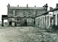 At the time of writing (December 2009) the 1847 building at Burntisland is undergoing sympathetic renovation by Historic Scotland as business premises. This was the terminus for trains to the north in the period before the Forth Bridge opened in 1890 when Burntisland became a through station on a different alignment. The traces of the hipped roof above the one-time buffer stops are obvious and I hope will not be 'renovated away'. Estate agents eventually gave up trying to let the former platform building on the right (most recently [but that's relative] a railwaymen's social club) and bricked up the windows, but at least it's still there. Photographed on 31 March 2002. <br>
<br><br>[David Panton 31/03/2002]