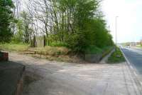 In a country lane off the busy A165 road on the Yorkshire coast stands a wooden gate, seen here in October 2009.  The gate provided the only <I>public</I> entrance to a large station. The station saw use in the summer, almost exclusively on Saturdays, for an intensive period of around 9 hours. Passenger arrivals and departures during that relatively short spell would often run to several thousand people. This was the nature of the <I>excursion station</I> at Filey Holiday Camp, serving the former Butlins complex located on the other side of the road, with the main link between the two via a tunnel. [See image 26792] <br>
<br><br>[John Furnevel 11/10/2009]