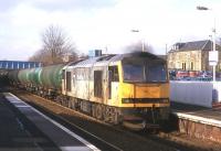 A Transrail-liveried Class 60 slows a train of oil empties for Grangemouth through Falkirk Grahamston in early 2001.<br>
<br><br>[David Spaven //2001]