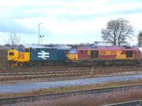 Class 37s are a rare sight in Inverness these days, but here we have 37425 <I>Pride of the Valleys/Balchder y Cymoedd</I> in BR blue <I>large logo</I> livery, seen at the stabling point in Millburn Yard, Inverness on 17 December, standing alongside EWS 67011.<br><br>[John Gray 17/12/2009]