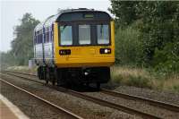 A Southport to Manchester Airport 'express' service bounces across West Lancashire on the approach to New Lane on 26 August 2009. Pacer 142012 is in charge but is unlikely to come to the attention of the air traffic controllers on this 'flight'.<br><br>[John McIntyre 26/08/2009]