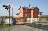 Closed in 1970, the former station at Speeton, just south of Hunmanby on the Yorkshire coast line, now a domestic conversion. View north over the crossing on 21 April 2009 with the village off to the right.<br><br>[John Furnevel 21/04/2009]