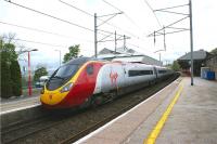 A northbound Pendolino calls at Oxenholme on 09 May 2009. The Windermere branch platform is to the left of the train.<br><br>[John McIntyre 09/05/2009]