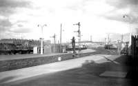 Platform scene at Forfar in 1959 looking towards Kinnaber Junction and Aberdeen. The locomotive shed can be seen in the left background. Forfar closed to passengers in September 1967 although the line back to Stanley Junction remained open for freight traffic until 1982. <br>
<br><br>[Robin Barbour Collection (Courtesy Bruce McCartney) 26/03/1959]