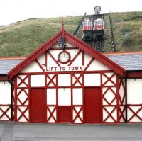 The Cliff Lift at Saltburn, one of the oldest of its type in the world. Each car carries a water tank under the floor. The tank of the car at the top station is filled to a level where it outweighs the car at the bottom, at which point it commences the 120 feet descent, at the same time pulling up the bottom car via a steel cable. Water from the tank of the car now at the bottom of the incline is pumped back to the top where the process begins all over again... Operations are controlled by a brake man in the cabin at the top. Saltburn's Cliff Lift, seen here on Tuesday 13 October (only open at weekends at this time of year), has been in operation since 1884.<br><br>[John Furnevel 13/10/2009]