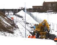 Old Dalry line out beyond Kilmarnock Long Lyes looking East towards the station (Long Lyes were beyond the bridge on the far side of the tracks). Road/rail machine is at the new buffer stops.<br><br>[Robert Blane 20/12/2009]