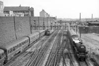 View south from Bradford Exchange station over the approach lines in the early 1960s, with Low Moor Black 5 no 44694 on an inbound train,  a DMU service outbound and two EE Type 4 diesels biding their time. For a 1990s view in the opposite direction featuring the surviving wall on the right [see image 27023]<br>
<br><br>[Robin Barbour Collection (Courtesy Bruce McCartney) //]