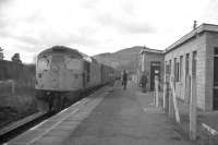 758 - A Kyle-Inverness train calls at Lochluichart in 1970 - the modern station building, and this new alignment for the railway, were created in 1954 when the original route was flooded for a hydro scheme.<br>
<br><br>[David Spaven //1970]