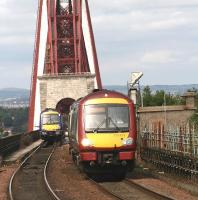 Trains passing at the south end of The Forth Bridge in September 2008.<br><br>[John Furnevel 08/09/2008]