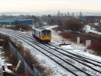 Having met the Christmas Eve Isle of Man ferry, Northern Pacer 142023 comes off the Heysham Port branch into Morecambe station where it will reverse and head for Leeds. The train crew operate the ground frame to access the branch.<br><br>[Mark Bartlett 24/12/2009]