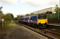 The Rochdale to Manchester Victoria via Oldham service enters the now closed Shaw and Crompton station on 1 October 2009 in the hands of 150136. In the left background a Class 142 Pacer unit stands in the turnback siding waiting to follow the Class 150 on a Shaw and Crompton to Manchester Victoria via Oldham service.<br><br>[John McIntyre 01/10/2009]