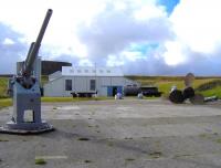 Although most of the massive former Royal Naval base at Scapa Flow, Orkney, has been demolished since World War II, there is a visitors <I>Interpretation Centre</I> located at Lyness on the island of Hoy. The photograph, taken in August 2006, shows part of the Lyness centre and various exhibits, including wagons that were once used to transport supplies and equipment around the base on the internal military railway system.<br><br>[Brian Smith 27/08/2006]
