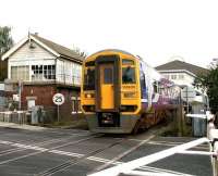 Northern 158906 emerges from below the overall roof of Beverley station on 1 October 2008 and is about to clear Armstrong Way level crossing with a southbound service from Bridlington which will call at Hull and Doncaster on its journey to Sheffield.<br><br>[John Furnevel 01/10/2008]