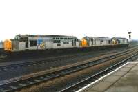 37716 <I>British Steel Corby</I> leads 37711 & 37719 onto the Pontefract line at Wakefield Kirkgate on 28 December 1986. The trio is heading back to Knottingley after refuelling at Healey Mills.<br><br>[David Pesterfield 28/12/1986]