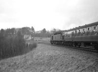 EE Type 4 no D316 is about to take the 1X39 return Edinburgh Waverley - Llanelli rugby special south onto Stobs Viaduct on 7 February 1965.  [See image 23859].<br><br>[Robin Barbour Collection (Courtesy Bruce McCartney) 07/02/1965]