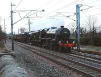 A very gloomy day for Ian Riley's second Black 5 no 44871, on its first outing, going from Manchester to Carlisle via Shap and returning via the S&C. It was on time to the minute coming north through Bay Horse in tandem with 45407 at 0915 on 30 December - but the sun had forgotten to get up this morning!<br><br>[Mark Bartlett 30/12/2009]