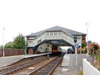 A DMU calls at Beverley in July 1986. Looking north towards Scarborough from the level crossing. <br><br>[Colin Miller /07/1986]