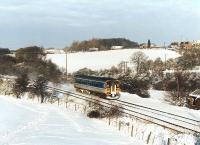 Happy New Year! Single unit 153331 runs between Crigglestone Junction and the former Crigglestone West station heading for Sheffield on a snowy New Year's Day 1997.<br><br>[David Pesterfield 01/01/1997]