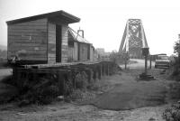 It's 1969, three years after closure of the Ballachulish line, and the wooden-built station at North Connel is looking very much the worse for wear. An intriguing early 60s' proposal to extend the line north across Loch Leven to Fort William (and close the expensive stretch of the West Highland line north of Crianlarich) came to nothing, and the Connel Ferry Bridge has carried only road vehicles since 1966. <br><br>[David Spaven //1969]